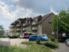 3-Zimmer-Dachgeschoßwohnung in Siegburg - Rückansicht mit Parkplatz